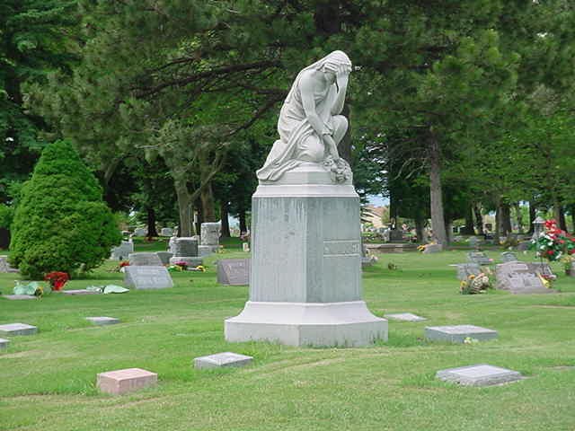 Logan Cemetery weeping woman statue side view